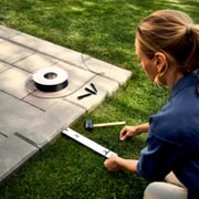 Slik legger du begrensningskabel til robotgressklipper